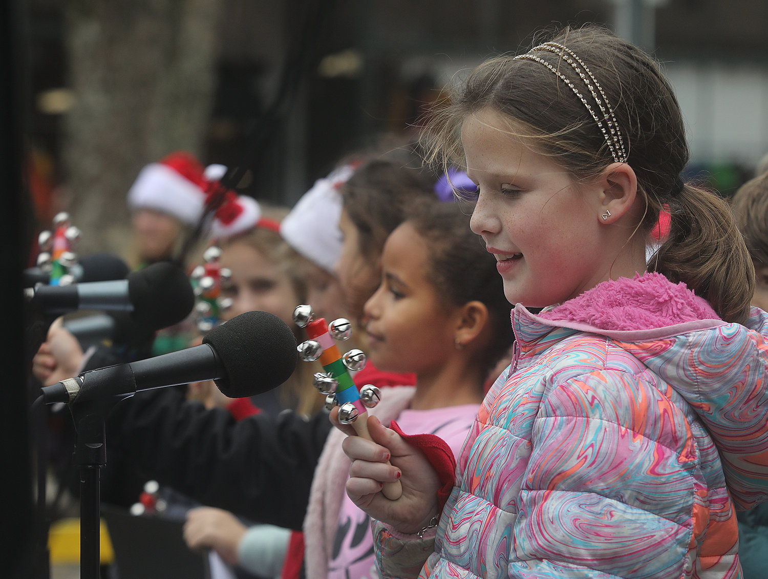 DECEMBER 3, 2022 -- Mackenzie Reader, 8, performs with others from the Boys and Girls Club at the stage on Main Street during Christmas Stroll. Photo by Ray K. Saunders