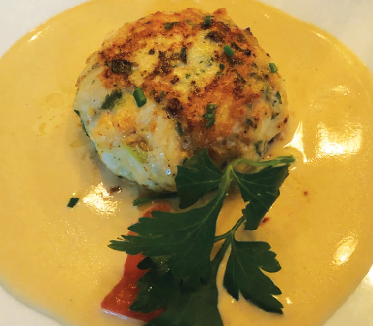 Crab cakes bound with a shrimp mousse and served with a mustard sauce were Club Car favorites.