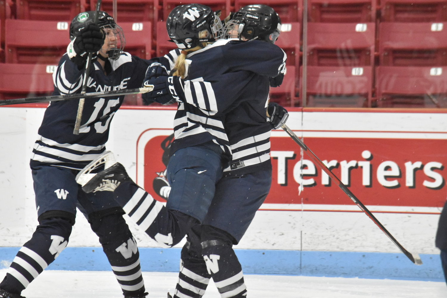 From left, Mia Beaudette, Bailey Lower and Mayson Lower celebrate Mayson's third period goal.