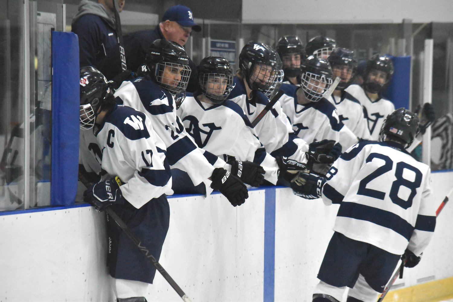 The Whalers congratulate Canton Jenkinson (28) after the freshman's second period goal in Wednesday's 6-3 win over Old Rochester.