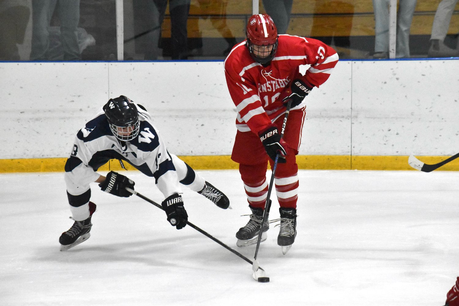 Jeremy Jenkinson pokes the puck away from a Barnstable player during Saturday’s 3-2 win.