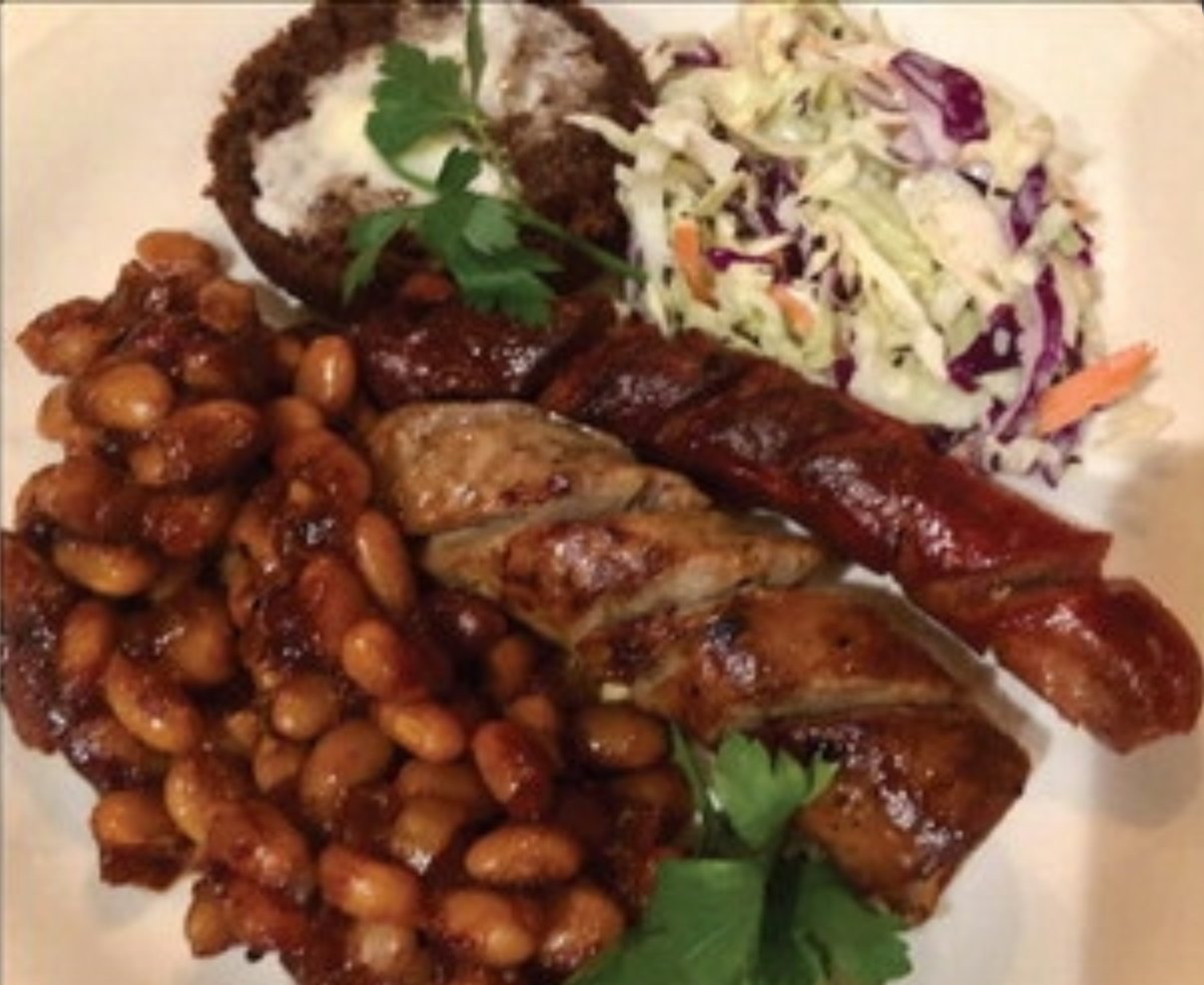 There’s no better way to take the chill off a cold winter day than with a plate of bourbon baked beans with grilled and spiralized sausages and hot dogs, with a side of cole slaw.