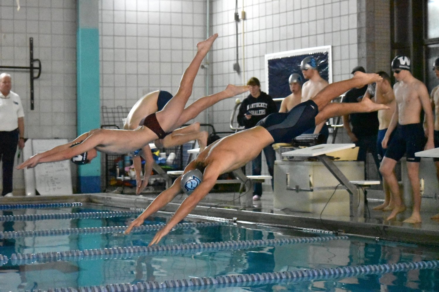 Jake Johnson, center, won the the 100-yard freestyle in 50.49 Wednesday at home against Sandwich.
