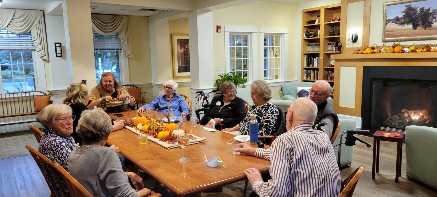 Sherburne Commons residents and guests gather in one of the common areas of the main building.