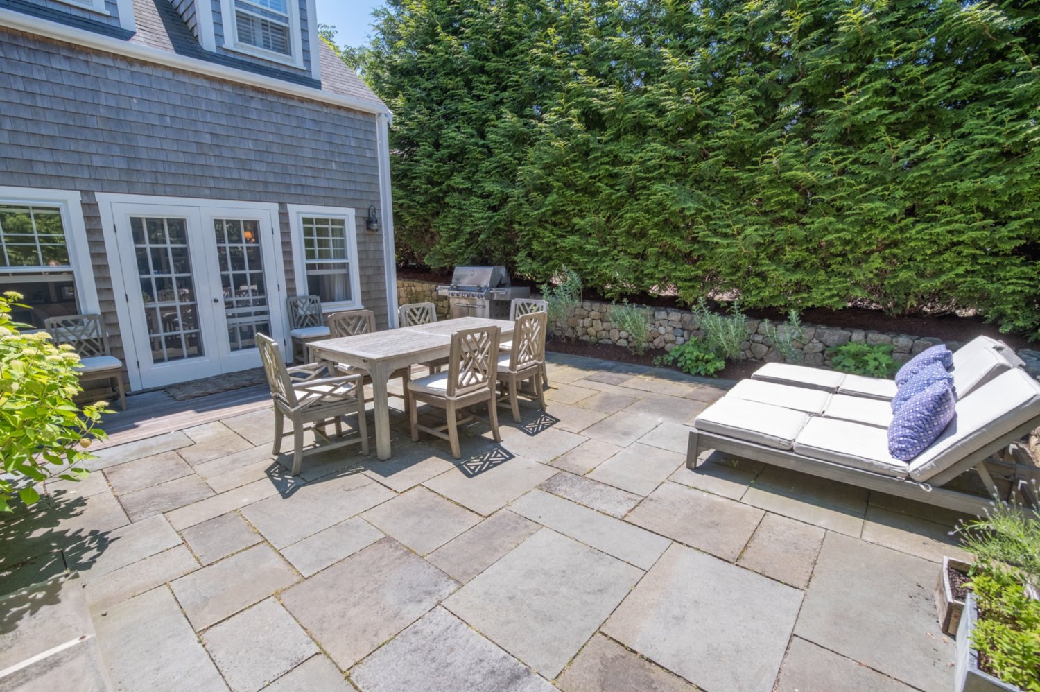 Outside the house is a stone patio with plenty of room for entertaining.