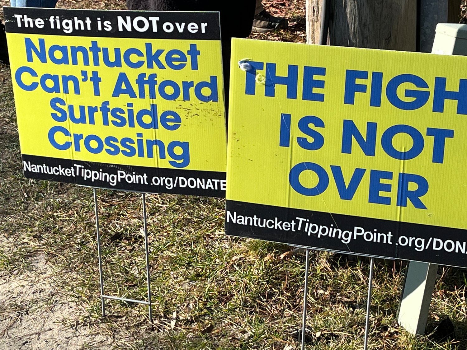 Opposition signs from Nantucket Tipping Point just outside the property Saturday morning.