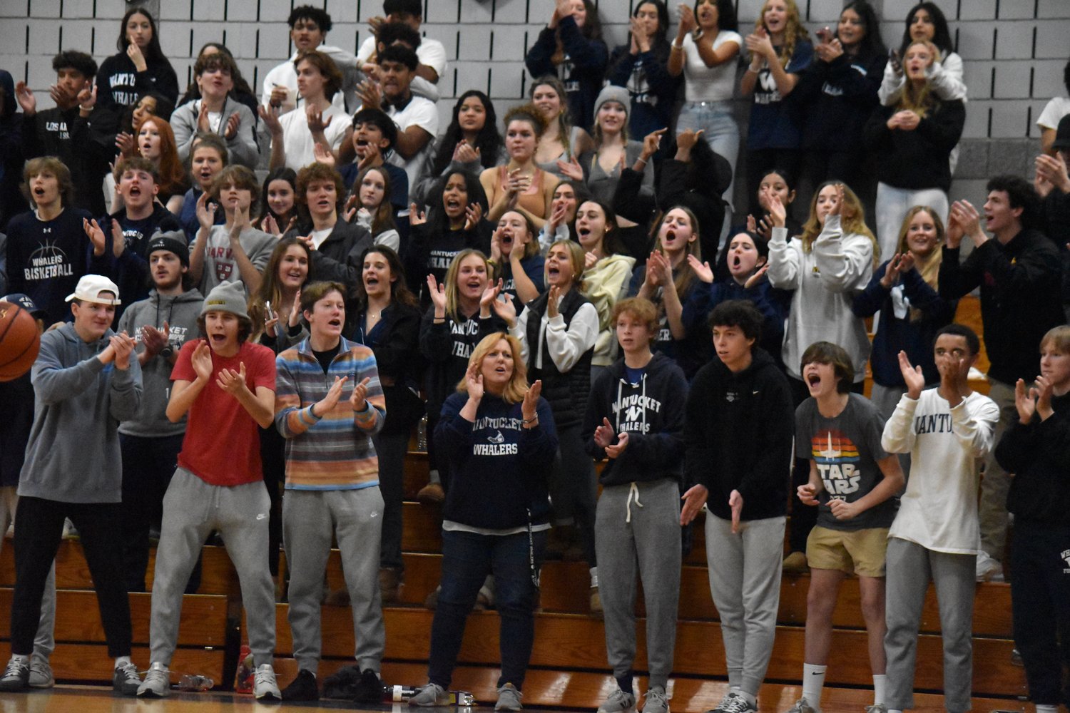 The student section celebrates a Nantucket basket.