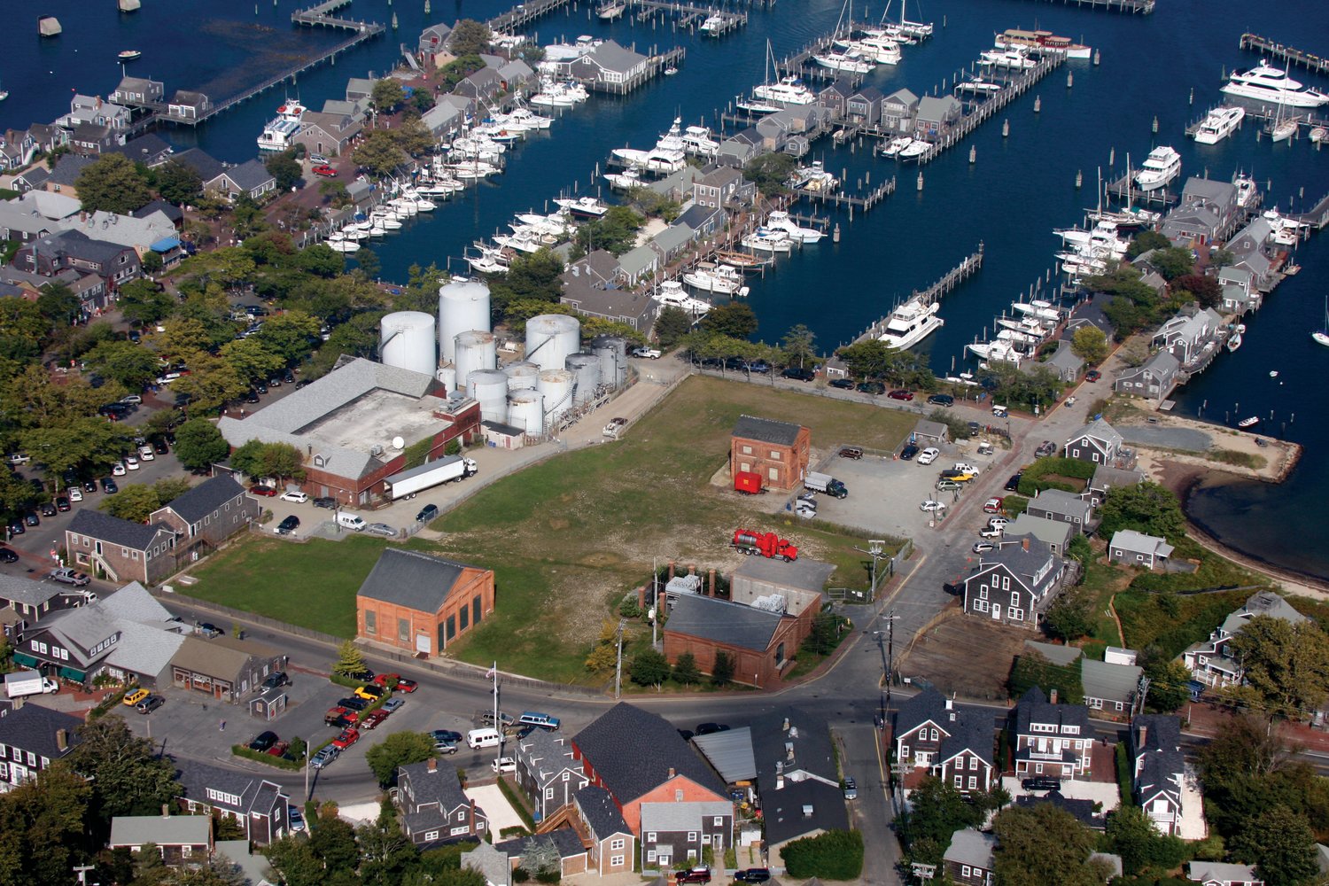 An aerial view of the downtown waterfront when the Harbor Fuel tank farm still occupied prime real estate just steps from the Nantucket Boat Basin.