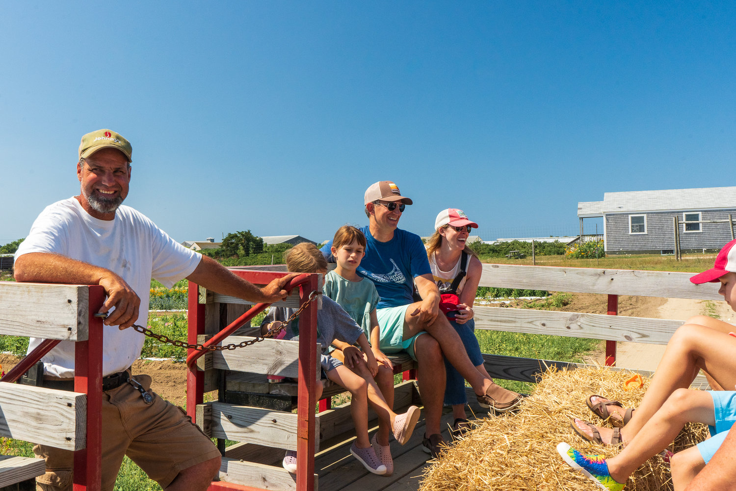David Bartlett, whose family has owned Bartlett’s Ocean View Farm since 1843, leads hayride farm tours each summer.