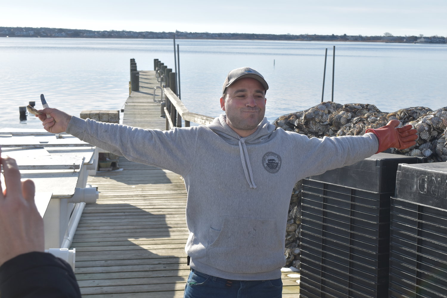 Nantucket shellfish hatchery technician Joe Minella celebrates a successful prediction.
