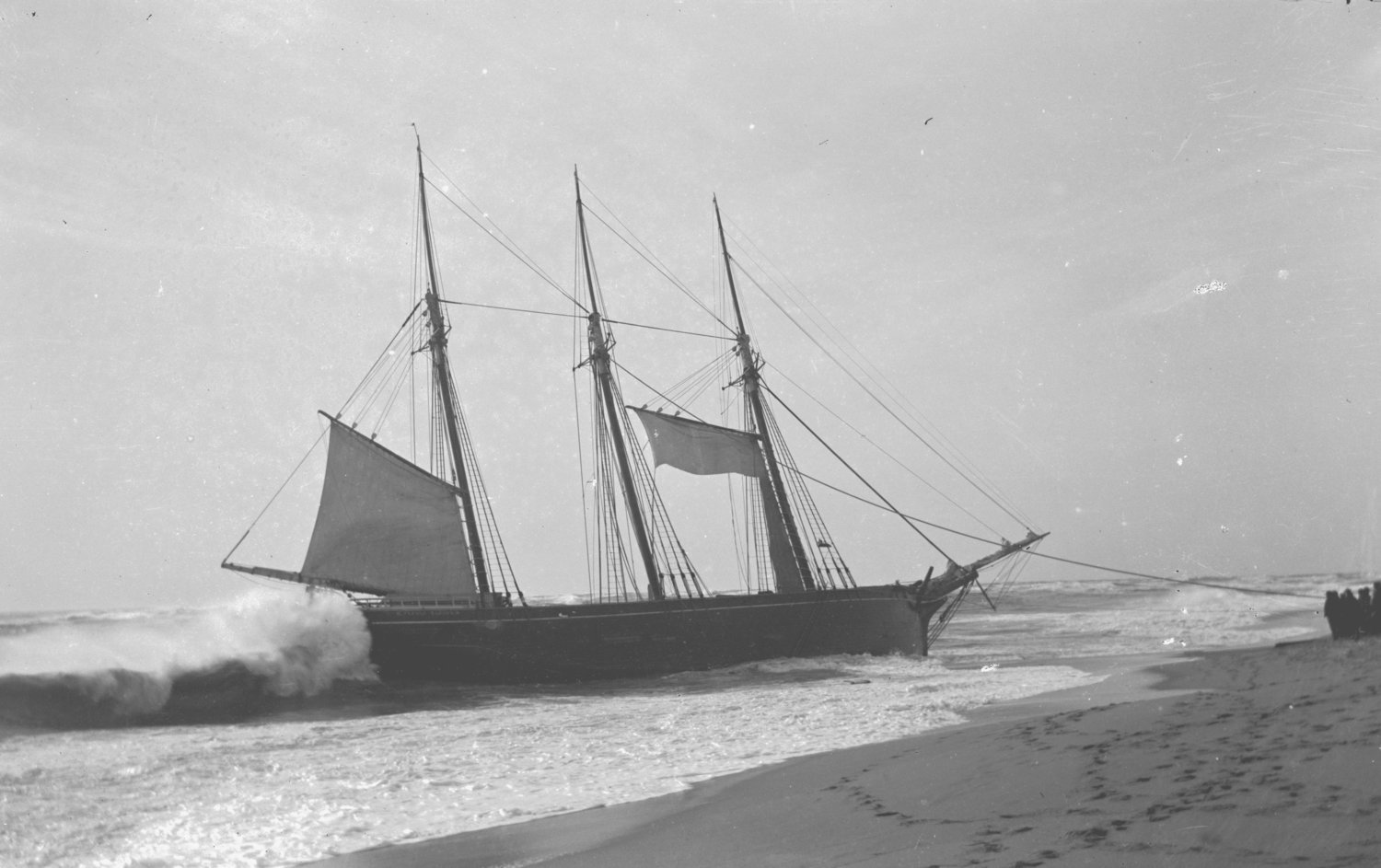 The cargo schooner Warren Sawyer after running aground on the south shore in December 1884.