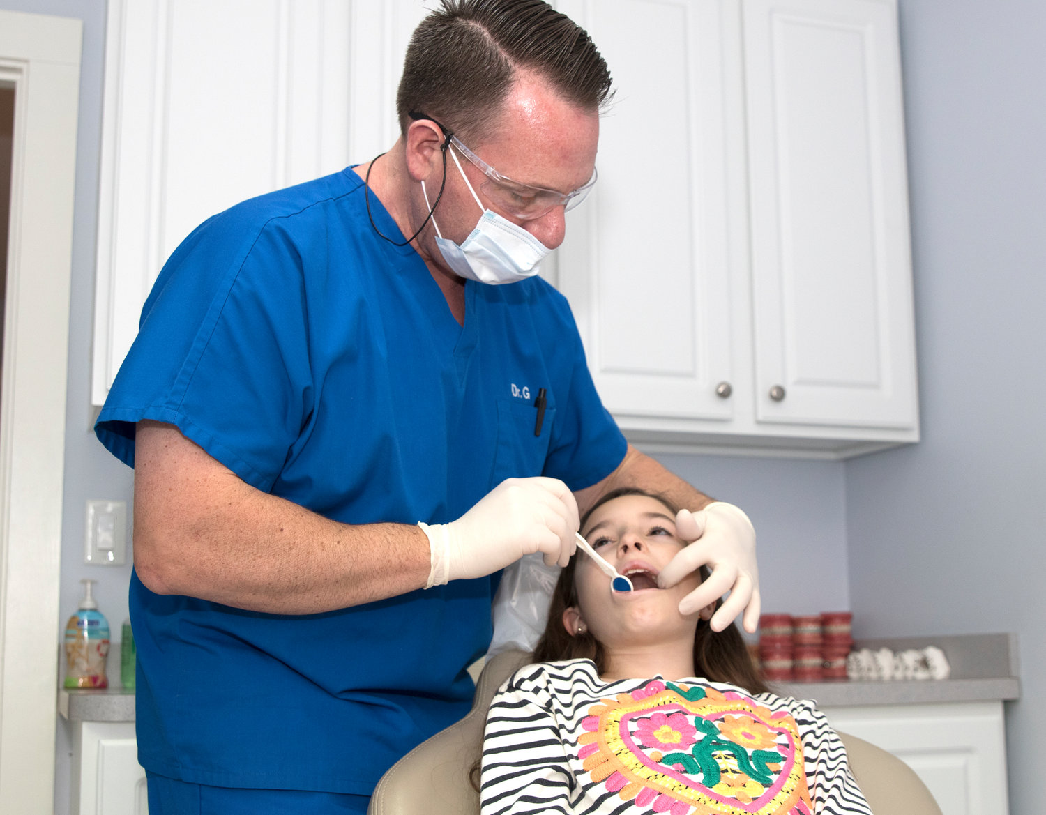 Dr. Brian Gaudreault works with a patient in Southeast Orthodontics’ office on Surfside Road.