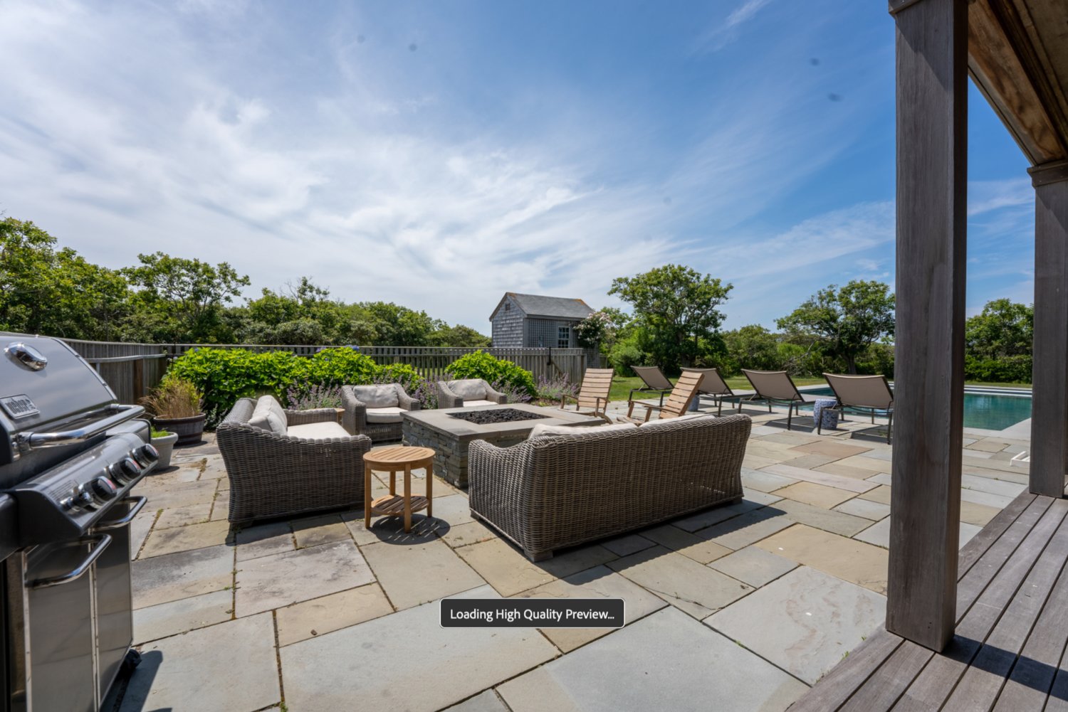 The bluestone patio is the perfect location for pool-side entertaining.