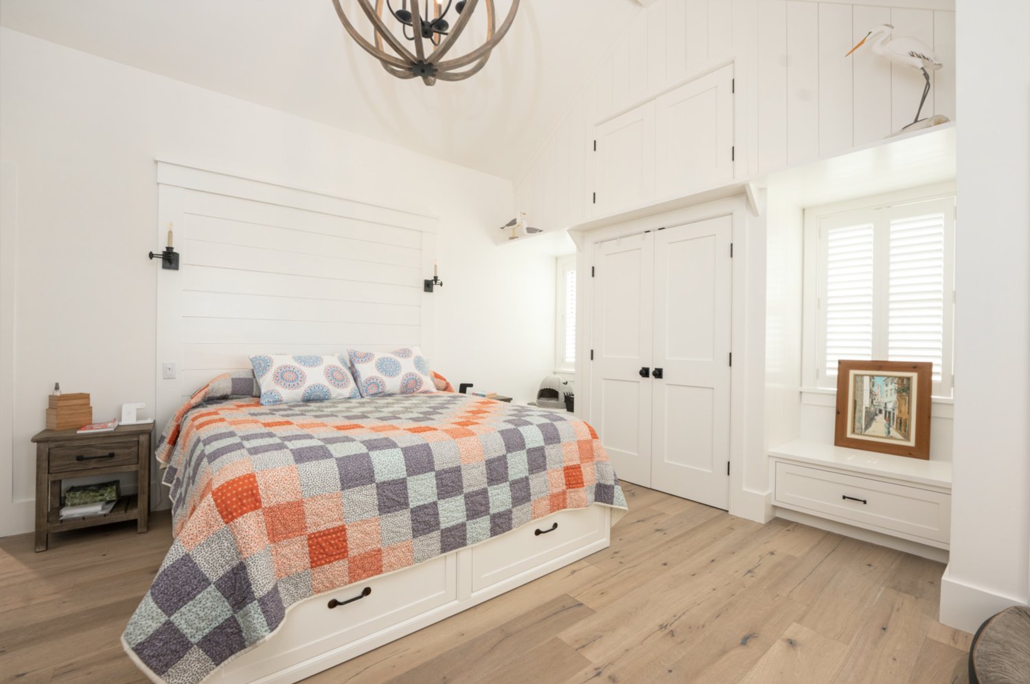 This bedroom has ample closet space and a vaulted ceiling.
