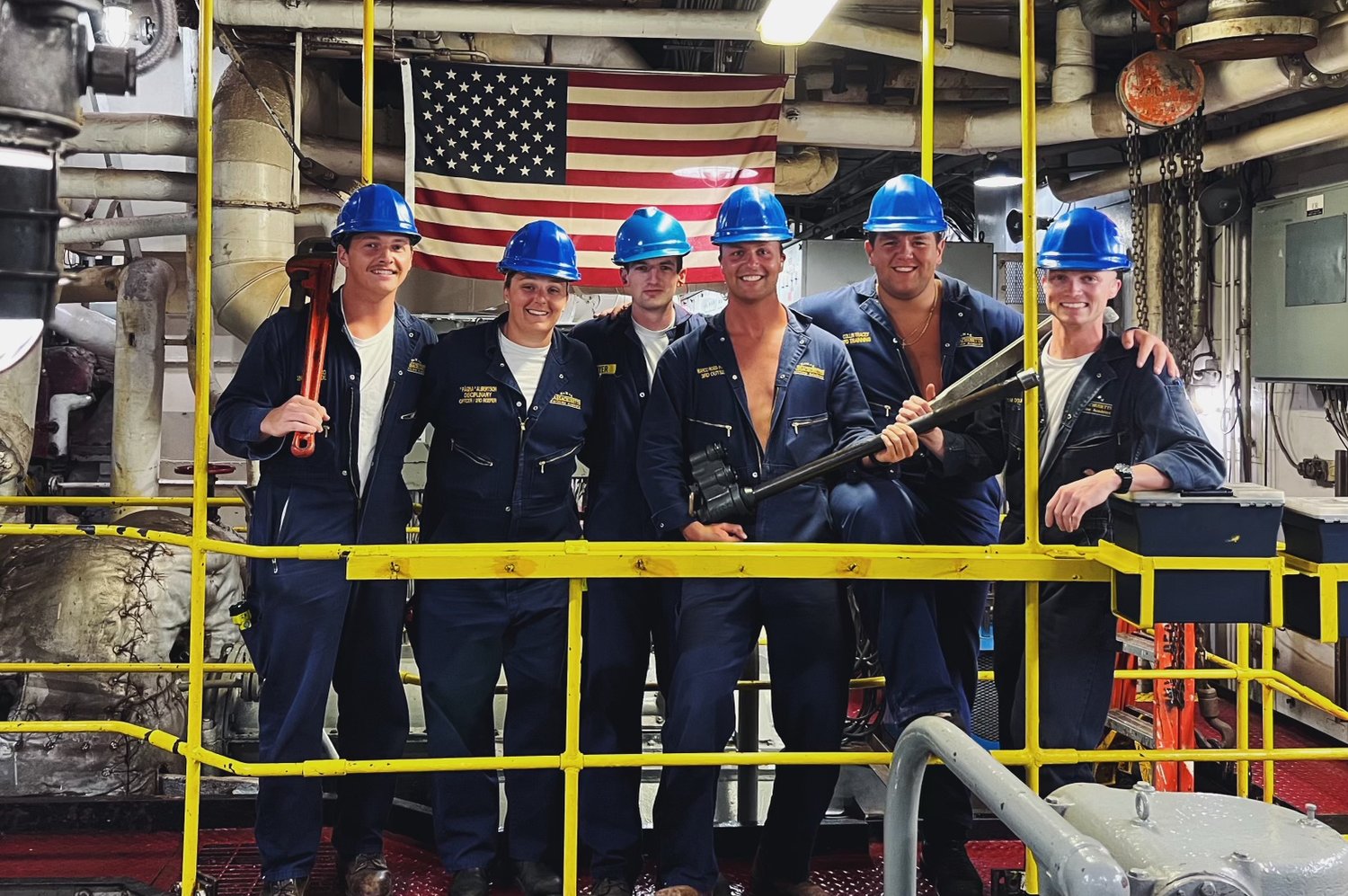Paige Albertson, second from left, in the engine room of the TS Kennedy with the other seniors on her watch team.