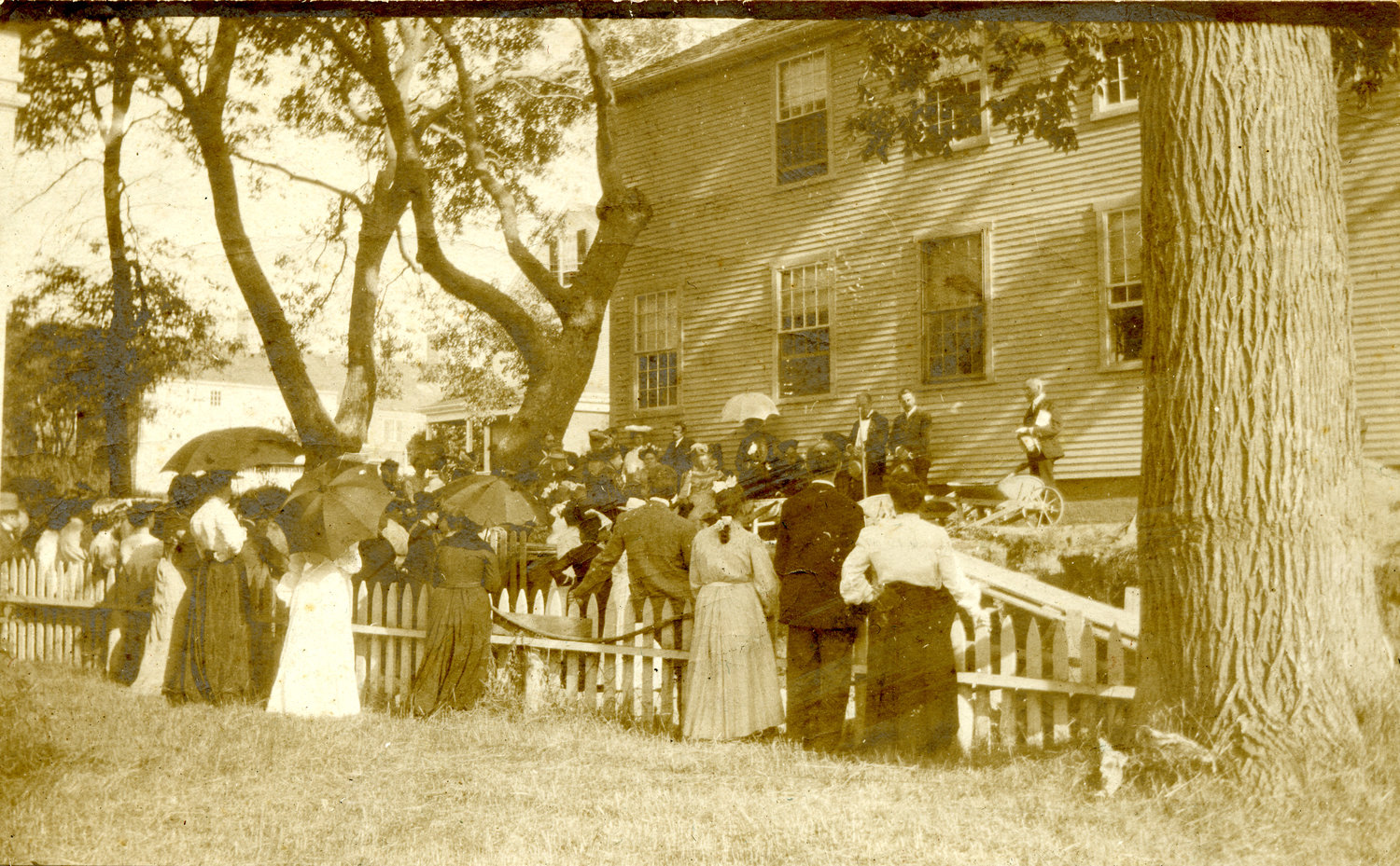 Crowd of onlookers watch the laying of the cornerstone for the addition of the research library at the time known as the Fair Street Museum, in 1904.