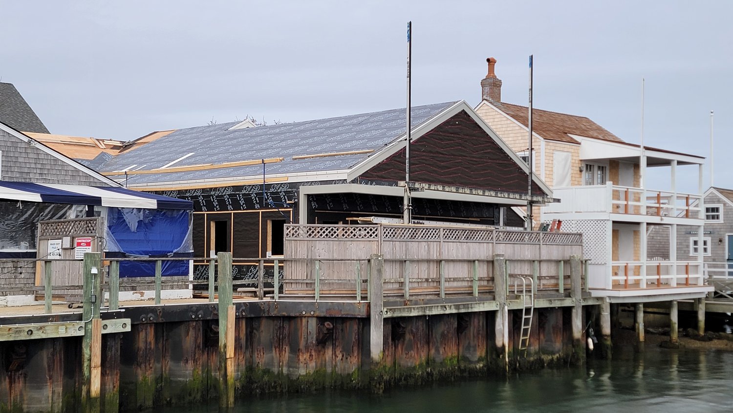 Major renovation work is ongoing at the former Straight Wharf Fish Store and Starz Ice Cream on Straight Wharf in preparation for its conversion into a casual-dining clam shack overlooking the water.