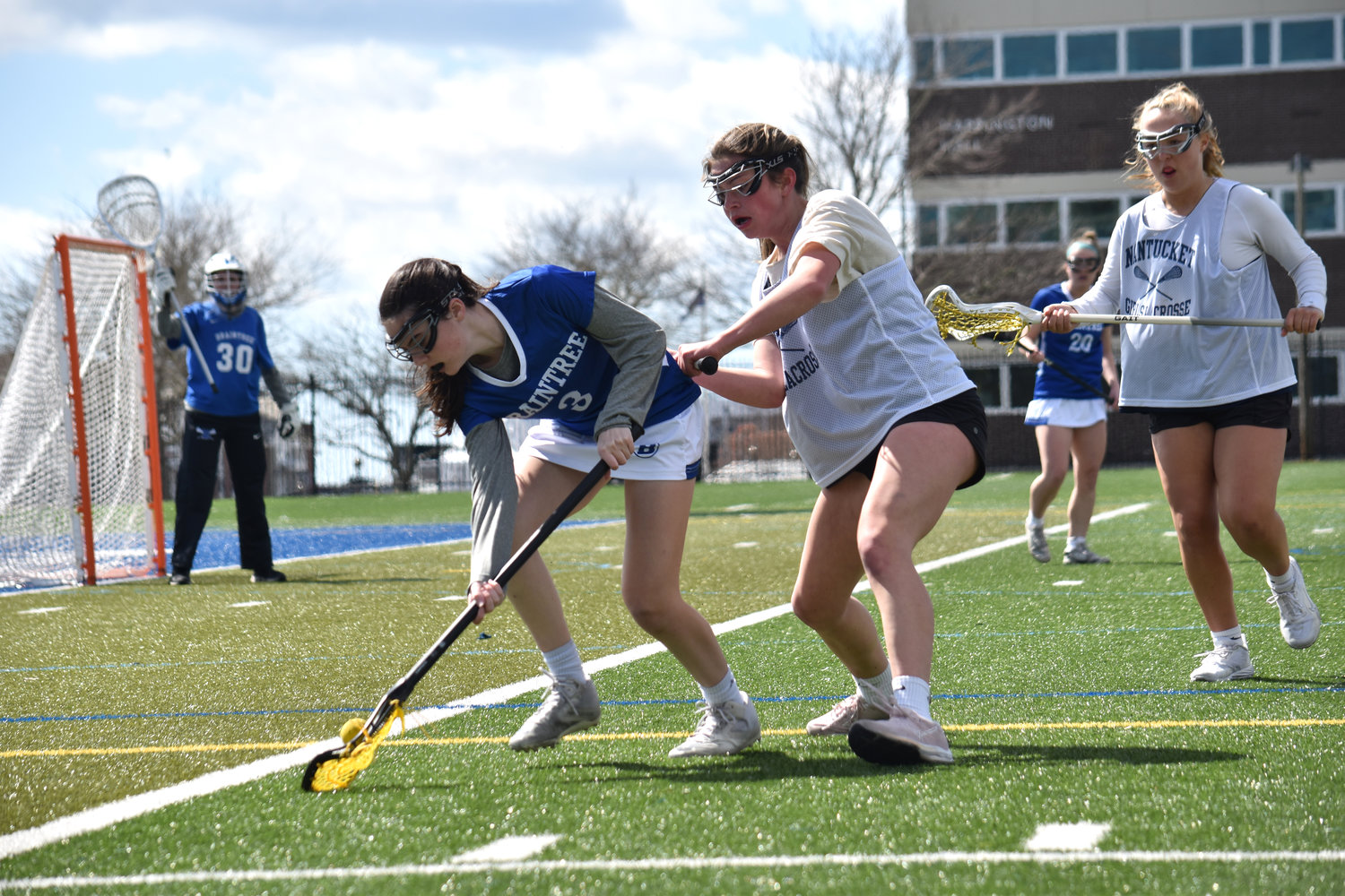Aille Sweeney and a Braintree player battle for a ground ball.