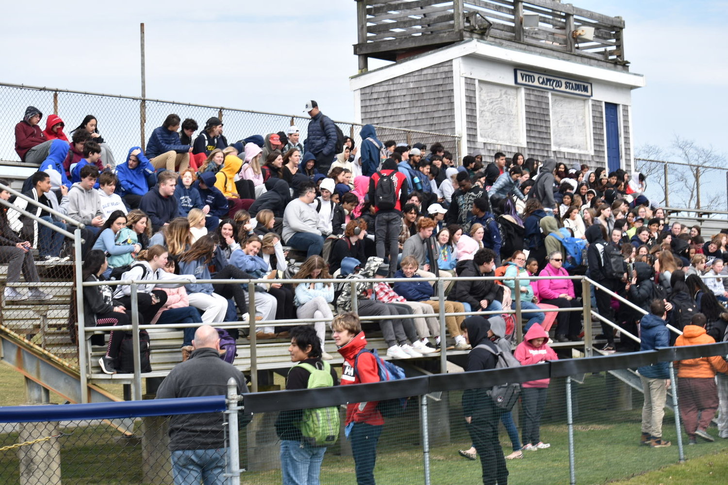 Students packed the football field bleachers during Friday's walkout.