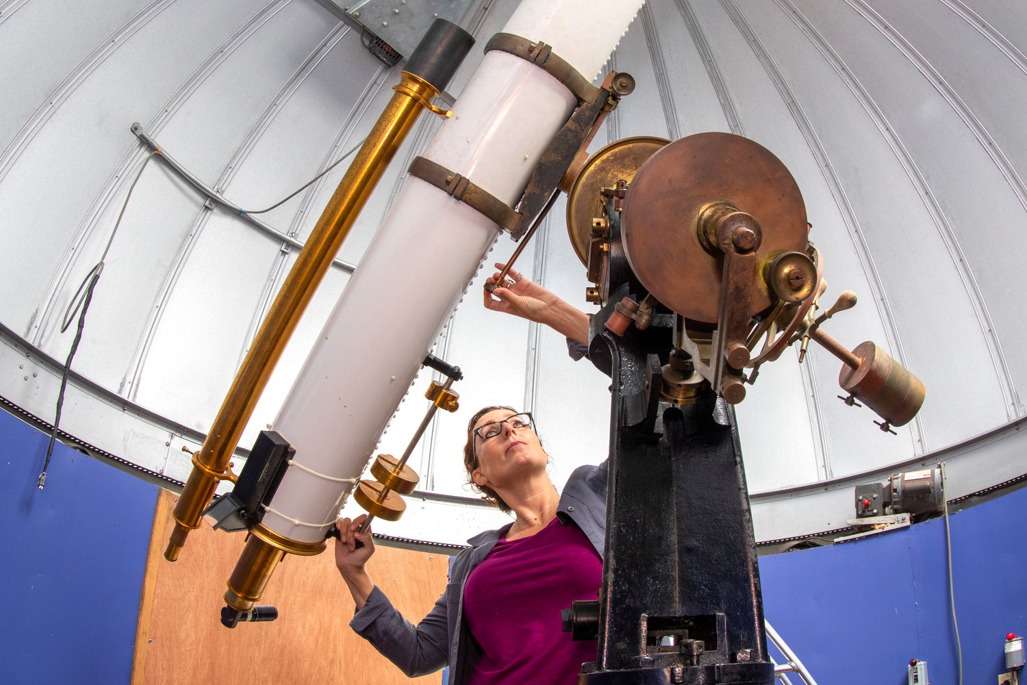Maria Mitchell Association director of astronomy Regina Jorgenson maneuvers the telescope at Loines Observatory.