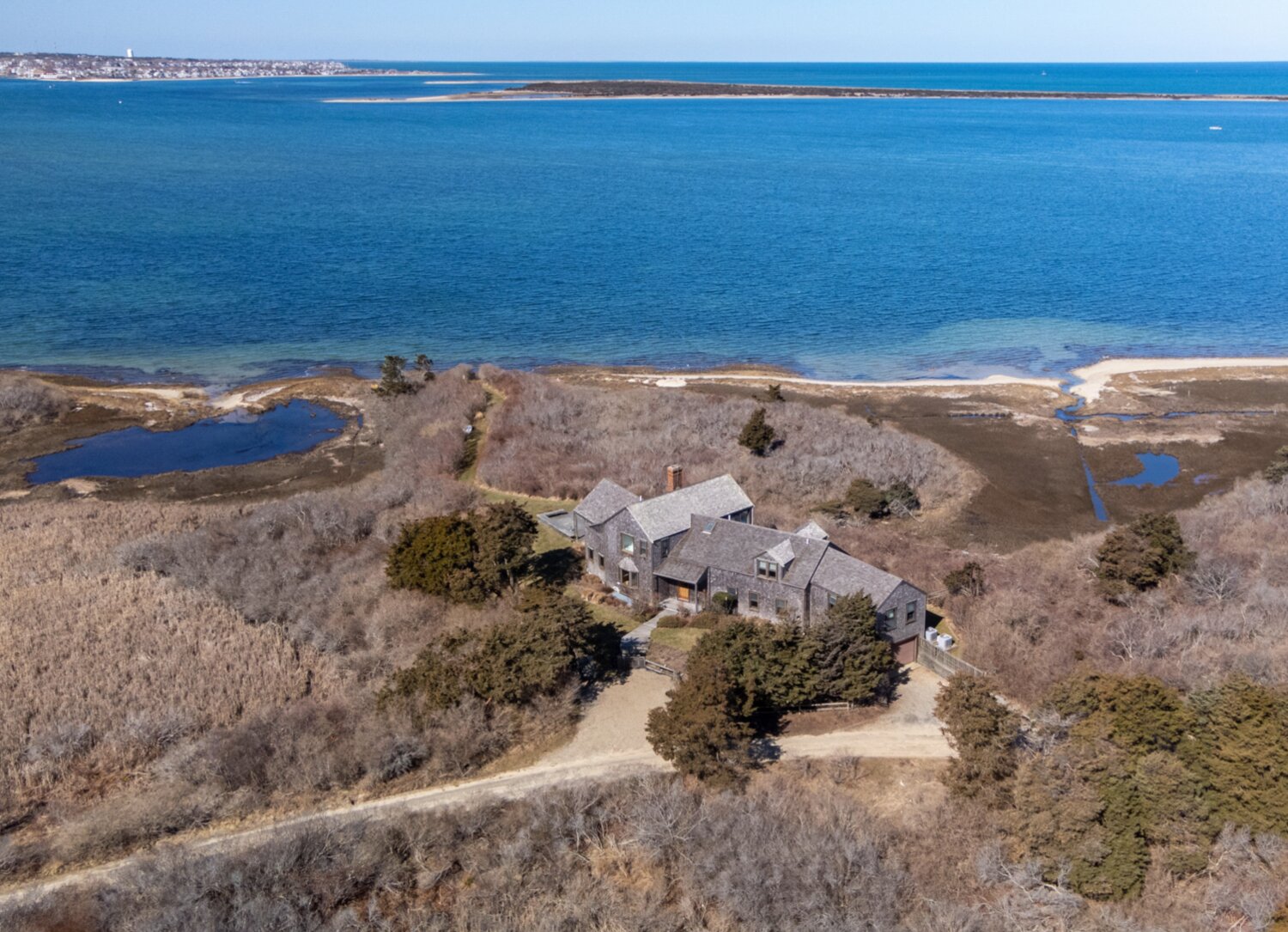 This four-bedroom, five-bathroom home is located on 6.8 acres of land in Shawkemo with sweeping, unobstructed views of the island and the skyline of historic downtown.