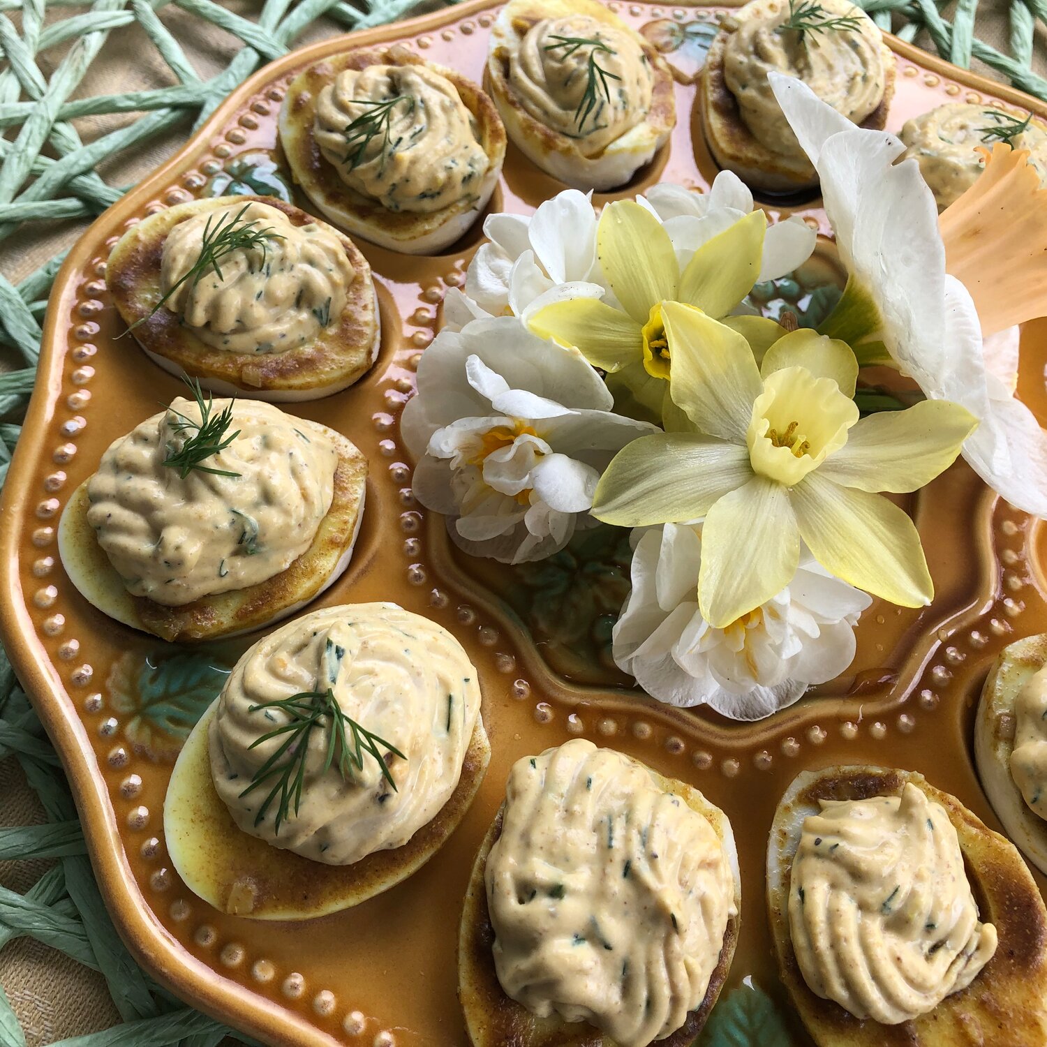 Deviled eggs, with their bright yellow centers are common daffodil picnic fare, but the flavor of these are enhanced by the use of curry in the filling.