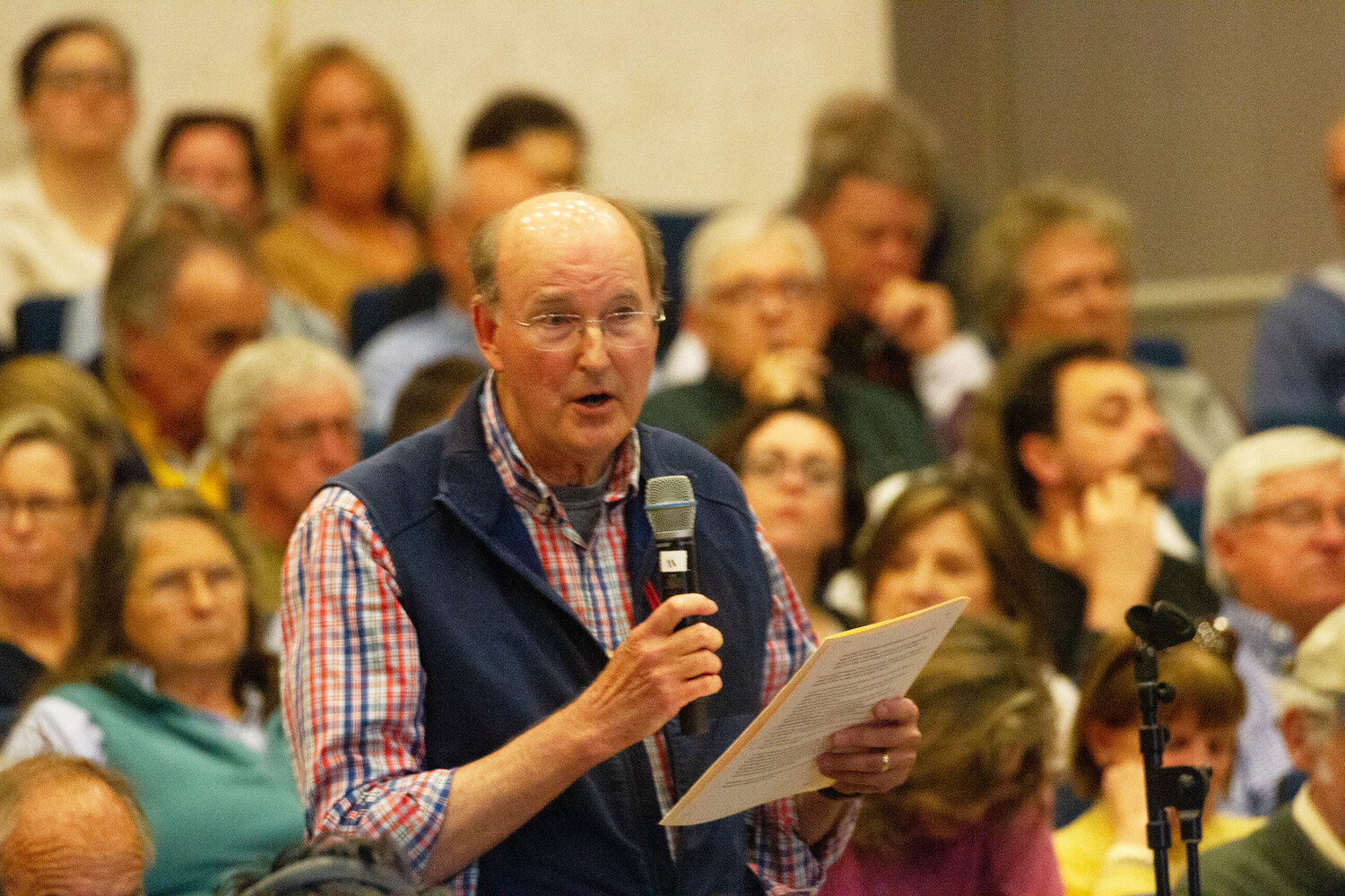 Short-term-rental work group member Jim Sulzer speaks on Town Meeting floor Saturday.