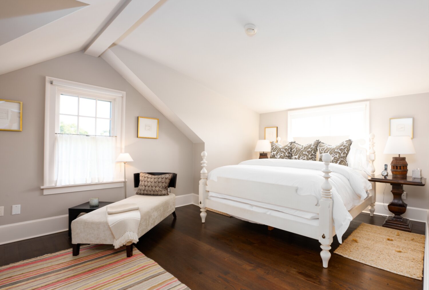 The east-facing bedroom suite has cathedral ceilings, a quaint reading nook and built-in cabinets.
