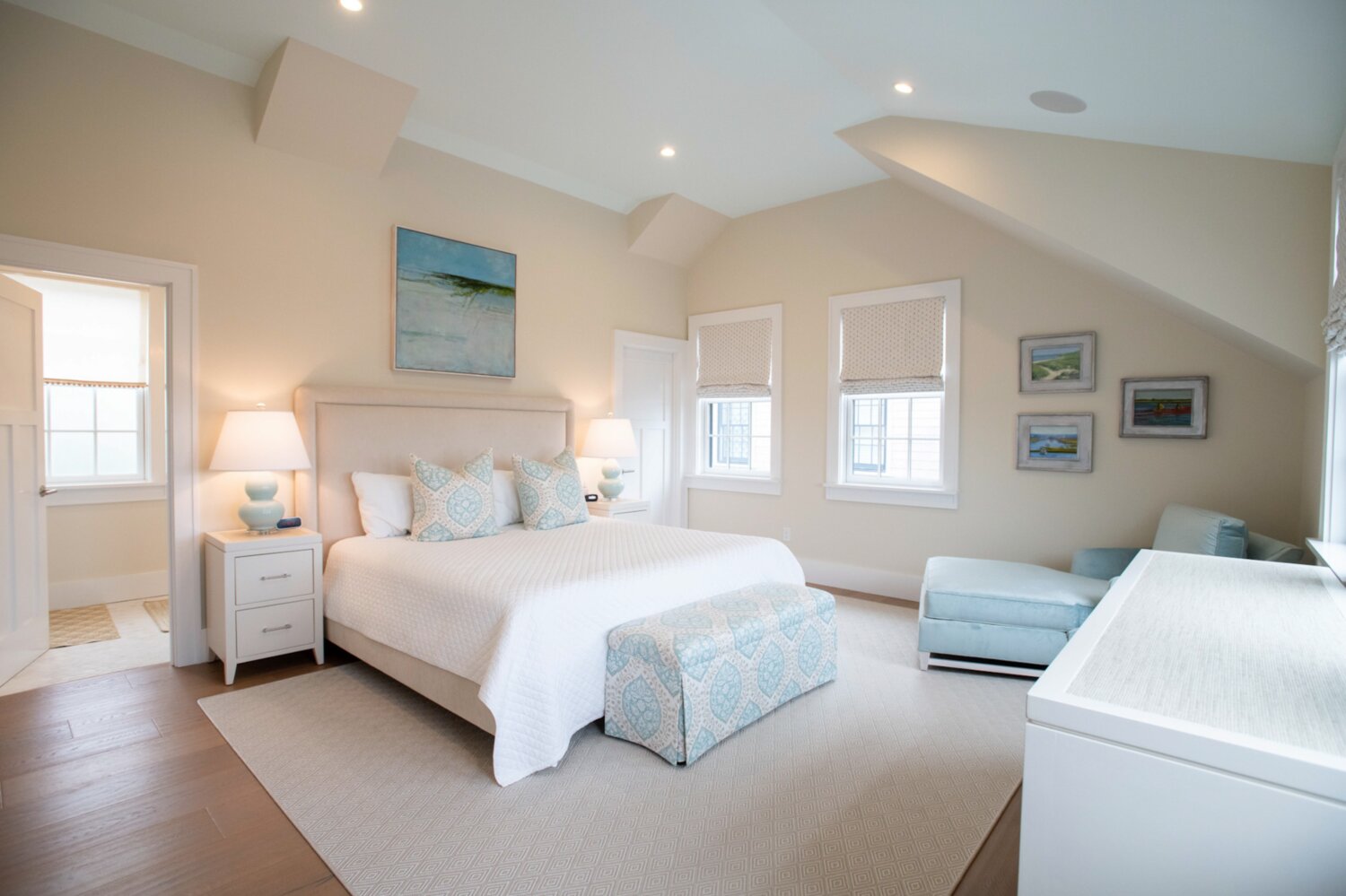 The east-facing bedroom suite has cathedral ceilings, a quaint reading nook and built-in cabinet.