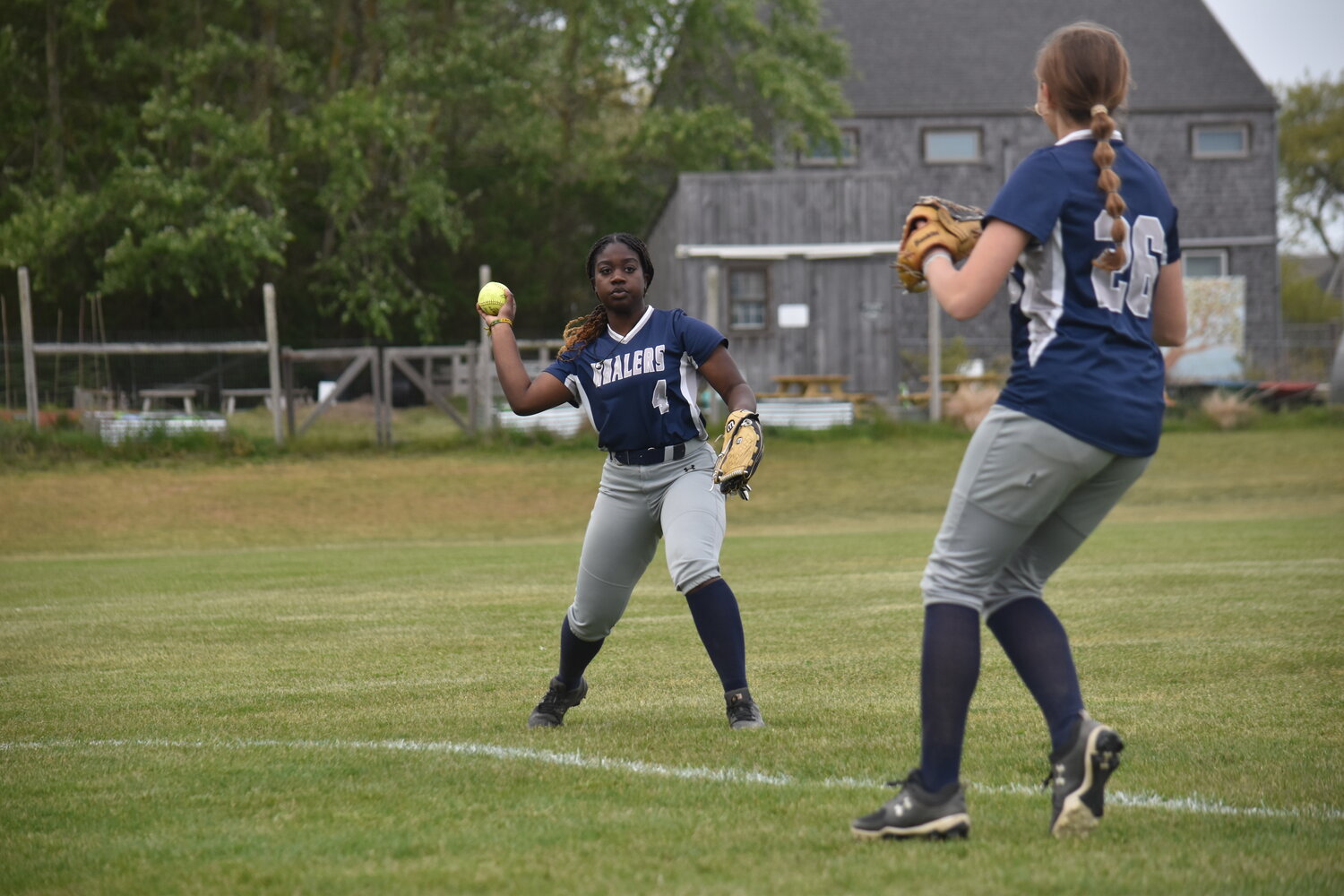 Rihanna Cranston throws the ball in from the outfield.