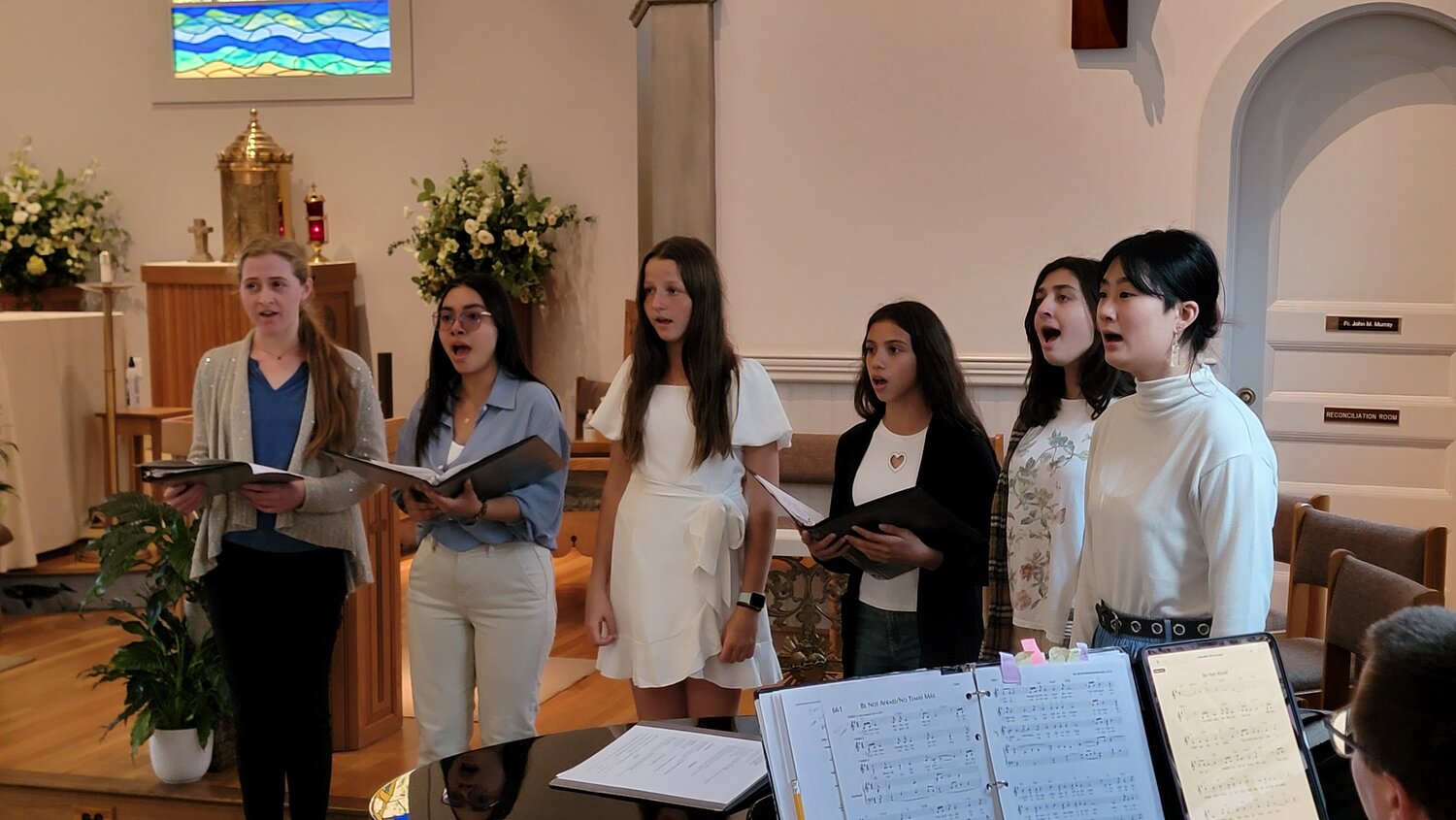 From left, Maria Frable, Adriana Salazar, Liepa Skehel, Fiorella Guiterrez, Maya Indrakanti and Meilynn Teng at St. Mary’s Catholic Church