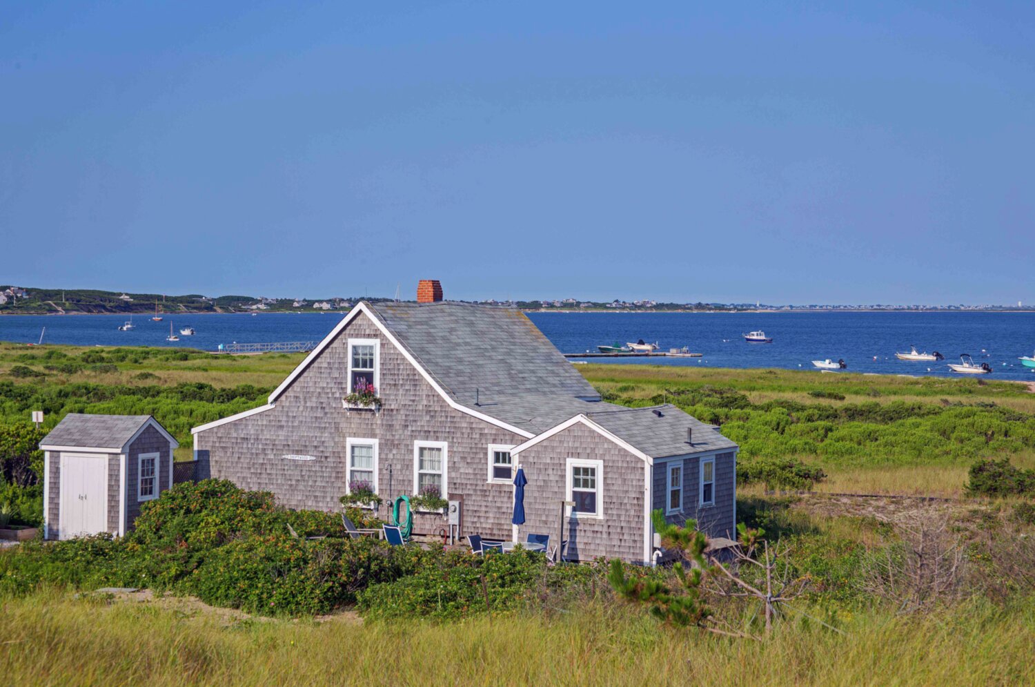 Nestled in the tranquil and picturesque area of Wauwinet on 1.2 acres of land, this quaint beach house provides the best a Nantucket summer can offer.