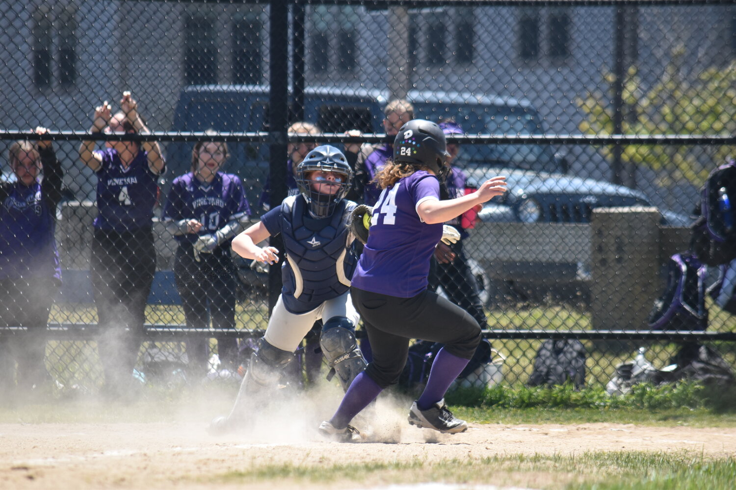 Aliza Scott tags out a Martha's Vineyard base runner at hone plate during Saturday's 29-8 win for the Whalers.