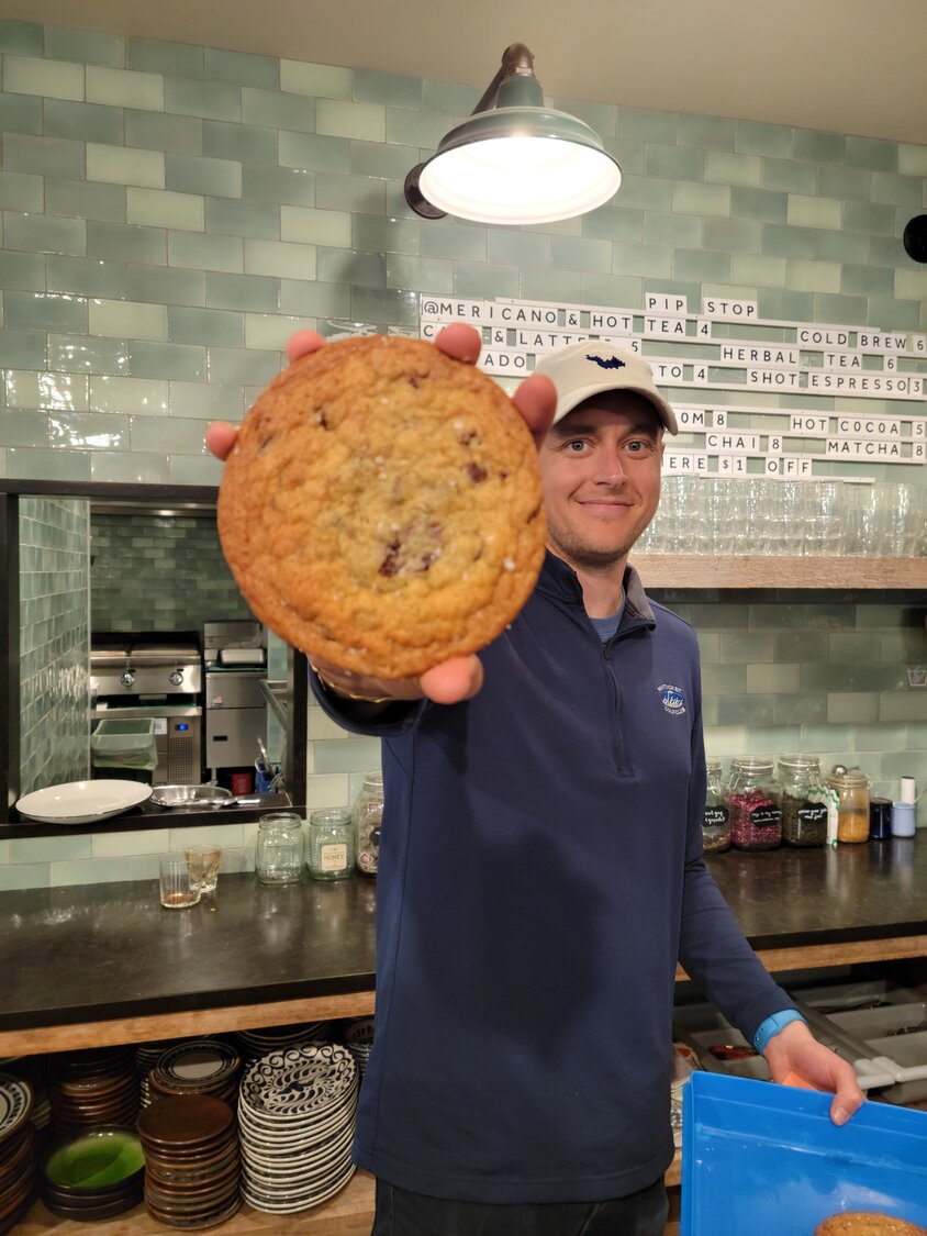 Co-owner Chris Sleeper with a Malted Chocolate Chip Cookie.