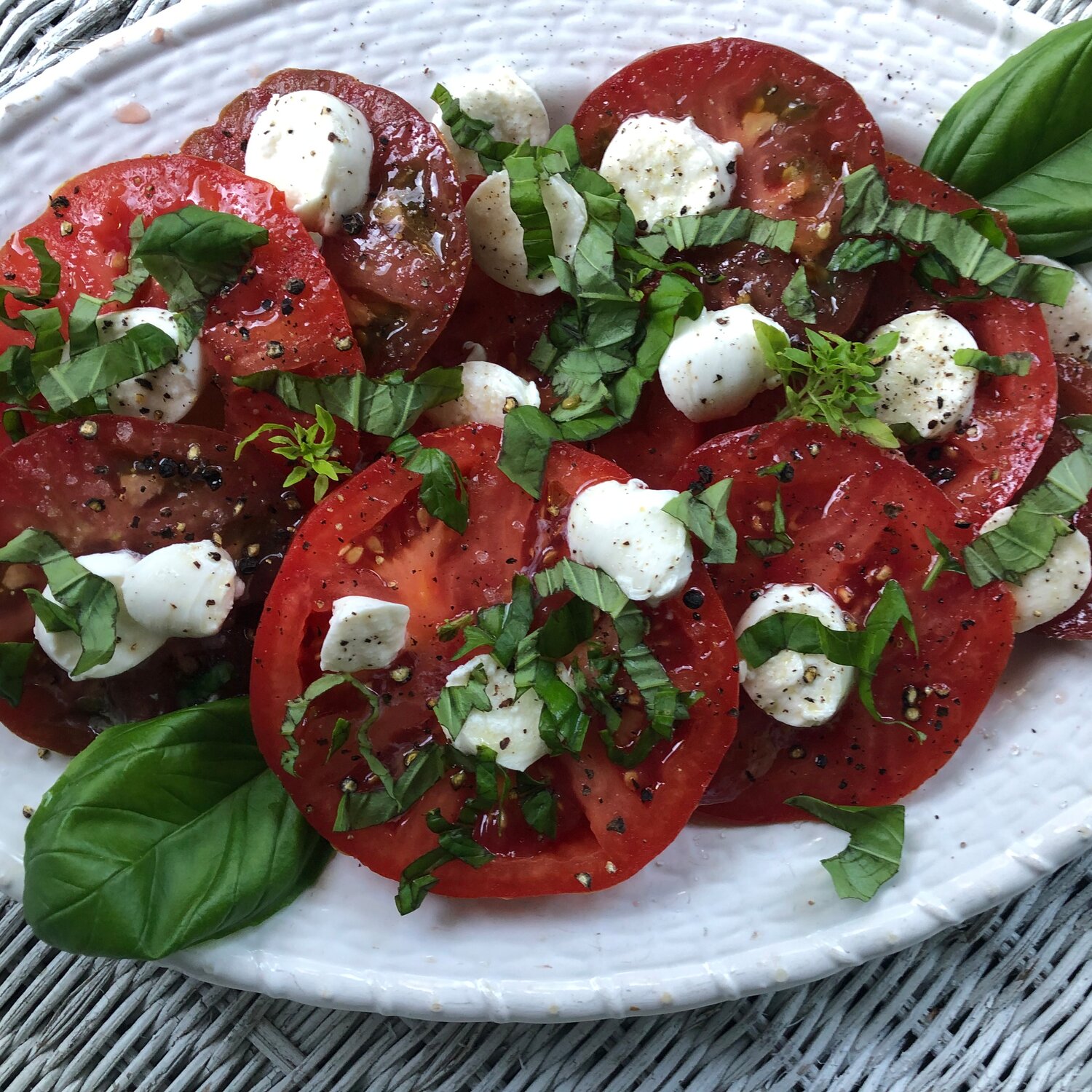 Tomato Caprese Salad is best made when fresh basil and vine-ripened tomatoes are in their prime.