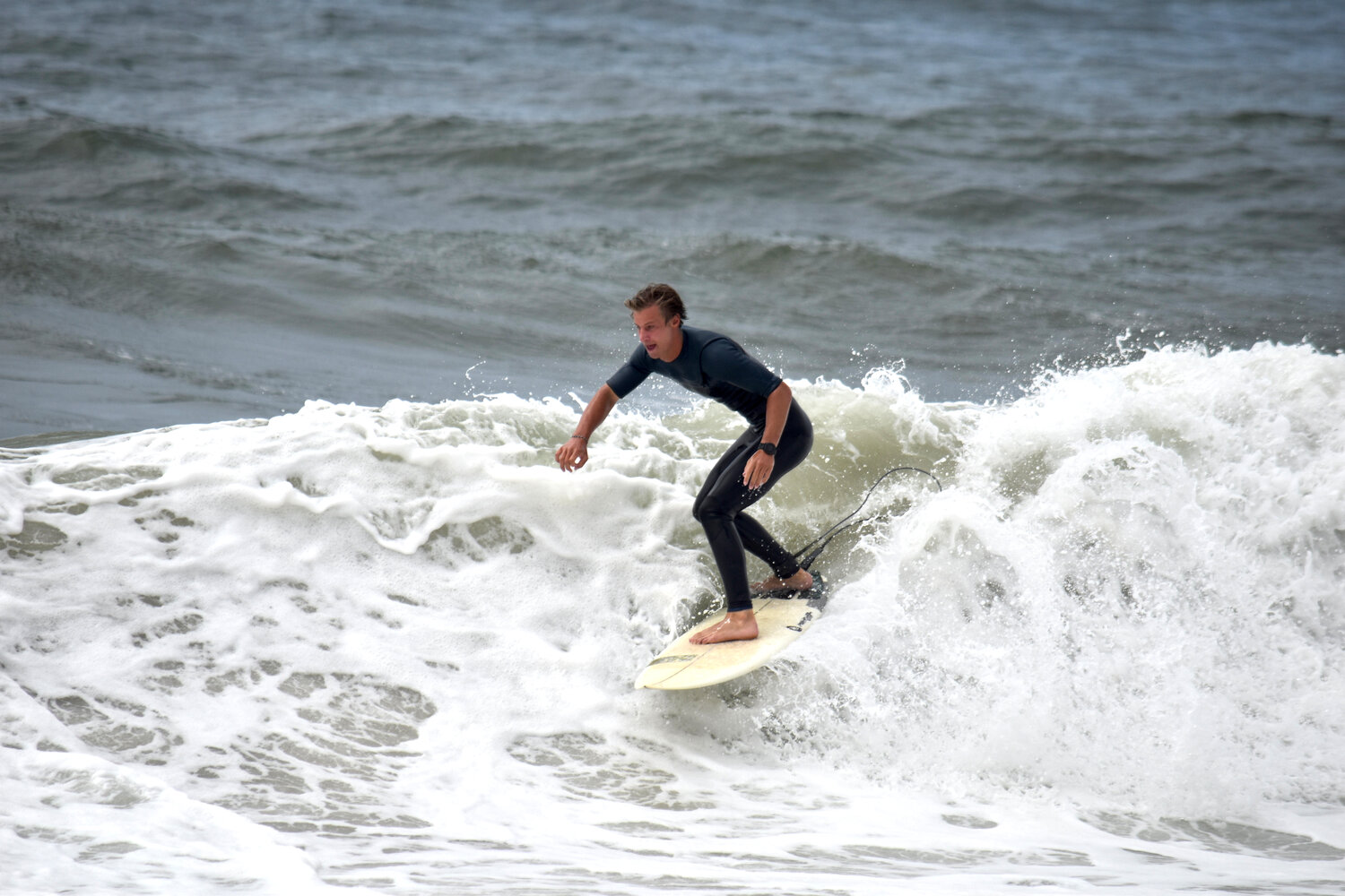 Surfers at Nobadeer Beach enjoyed large waves Monday, with heavy swells reported across the south shore.