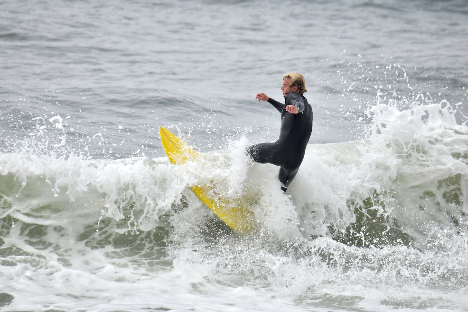 Surfers at Nobadeer Beach enjoyed large waves Monday, with heavy swells reported across the south shore.
