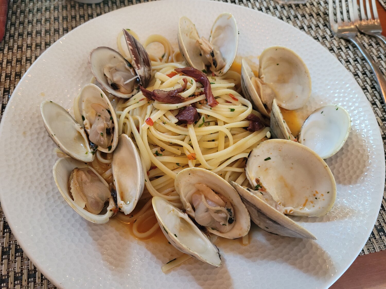 The Linguine with Clams overflows with succulent littlenecks in a wine sauce.