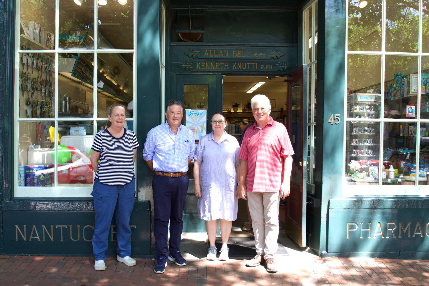 From left, Joanne Skokan, Ken Knutti, Jill Audycki and Allan Bell outside Nantucket Pharmacy on Main Street Tuesday.