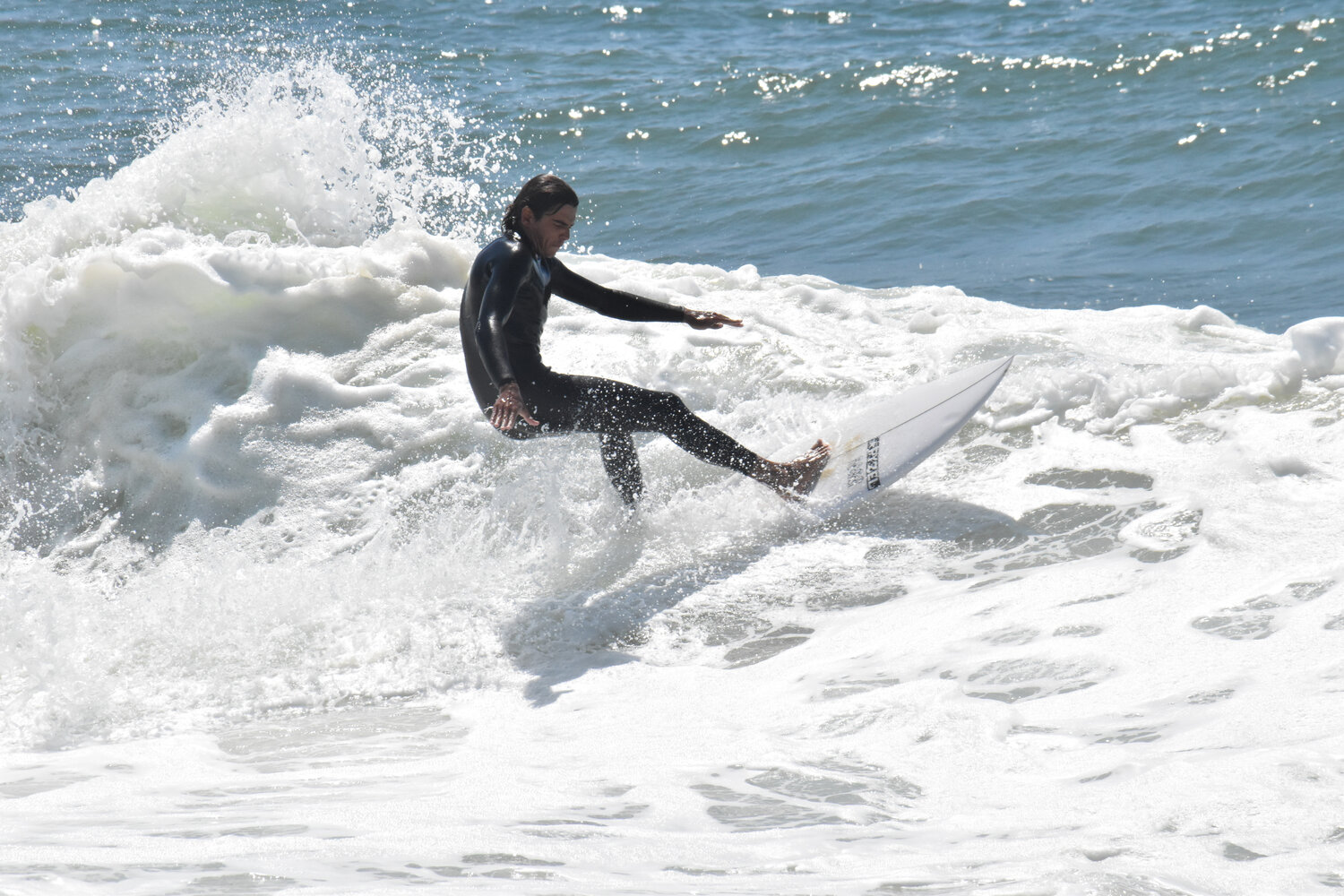 With a high surf advisory in effect, dozens of surfers hit the water along the south shore Friday.