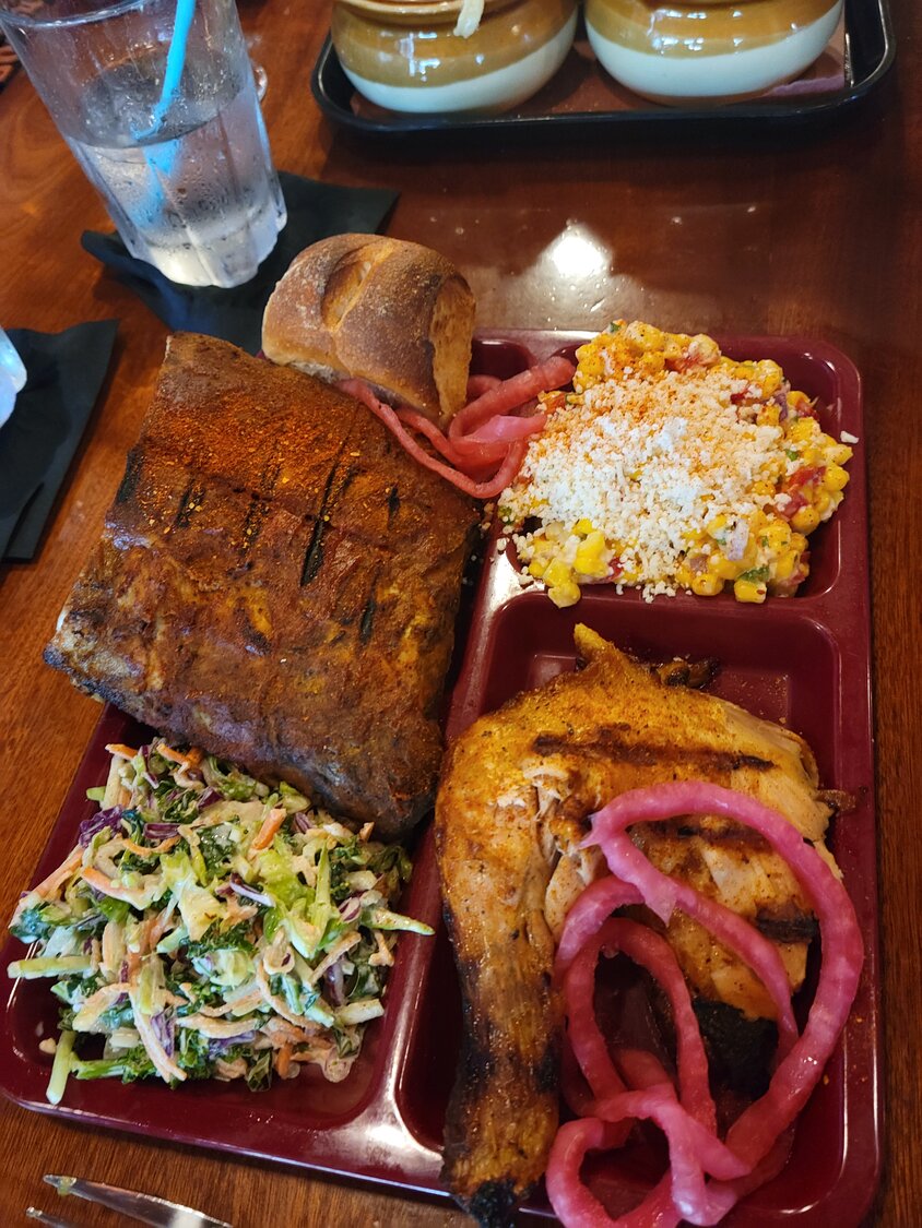 Bring a hearty appetite if you want to tackle this platter of barbecue ribs, smoked chicken, coleslaw and street corn.