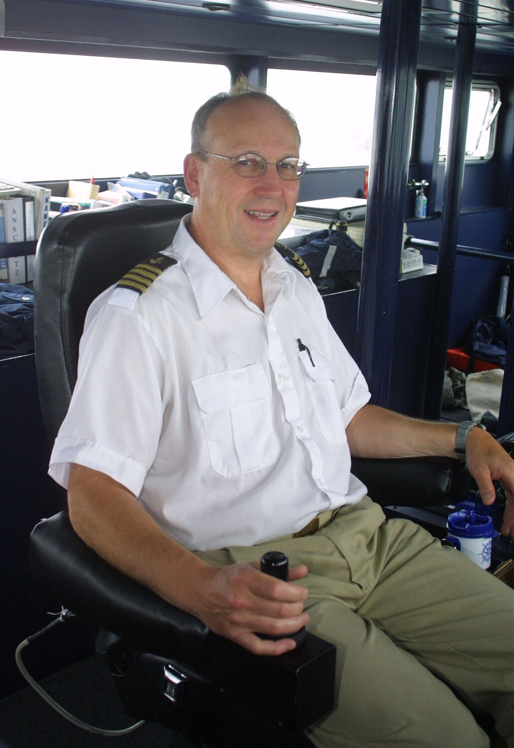 Retired Steamship Authority Capt. Bruce Malenfant at the helm of a fast ferry in 2003.