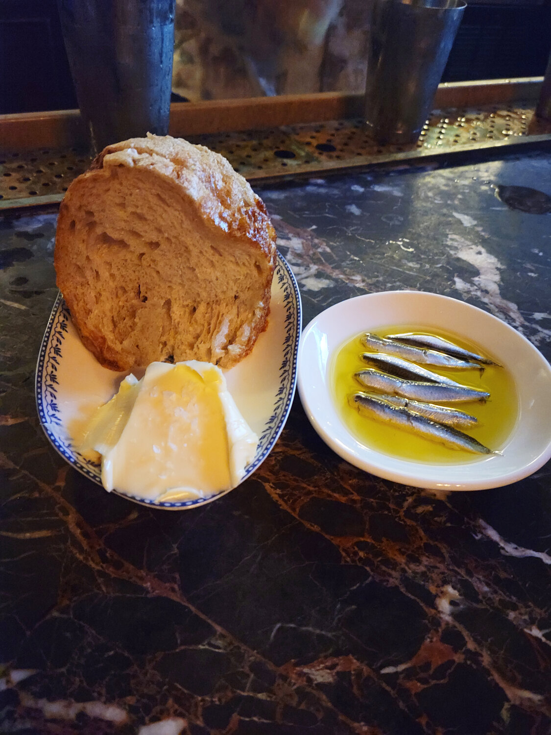 You can order Via Mare’s house-made bread with a side of boquerones, plump and umami-rich anchovies preserved in vinegar and oil.