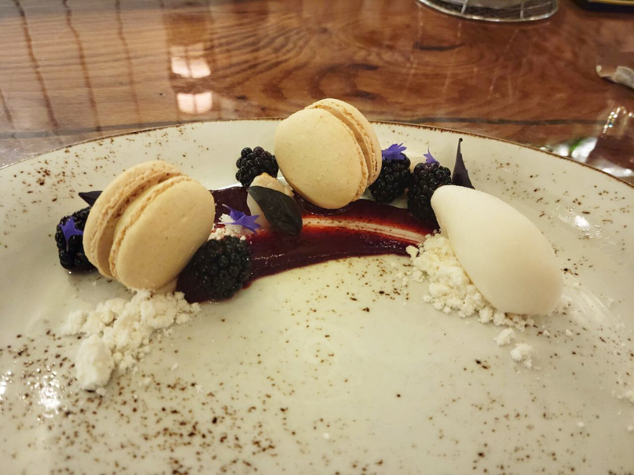 Dune’s macarons are served with fresh blackberries from Nantucket’s Eat Fire Farm, lychee sorbet and white chocolate “snow.”