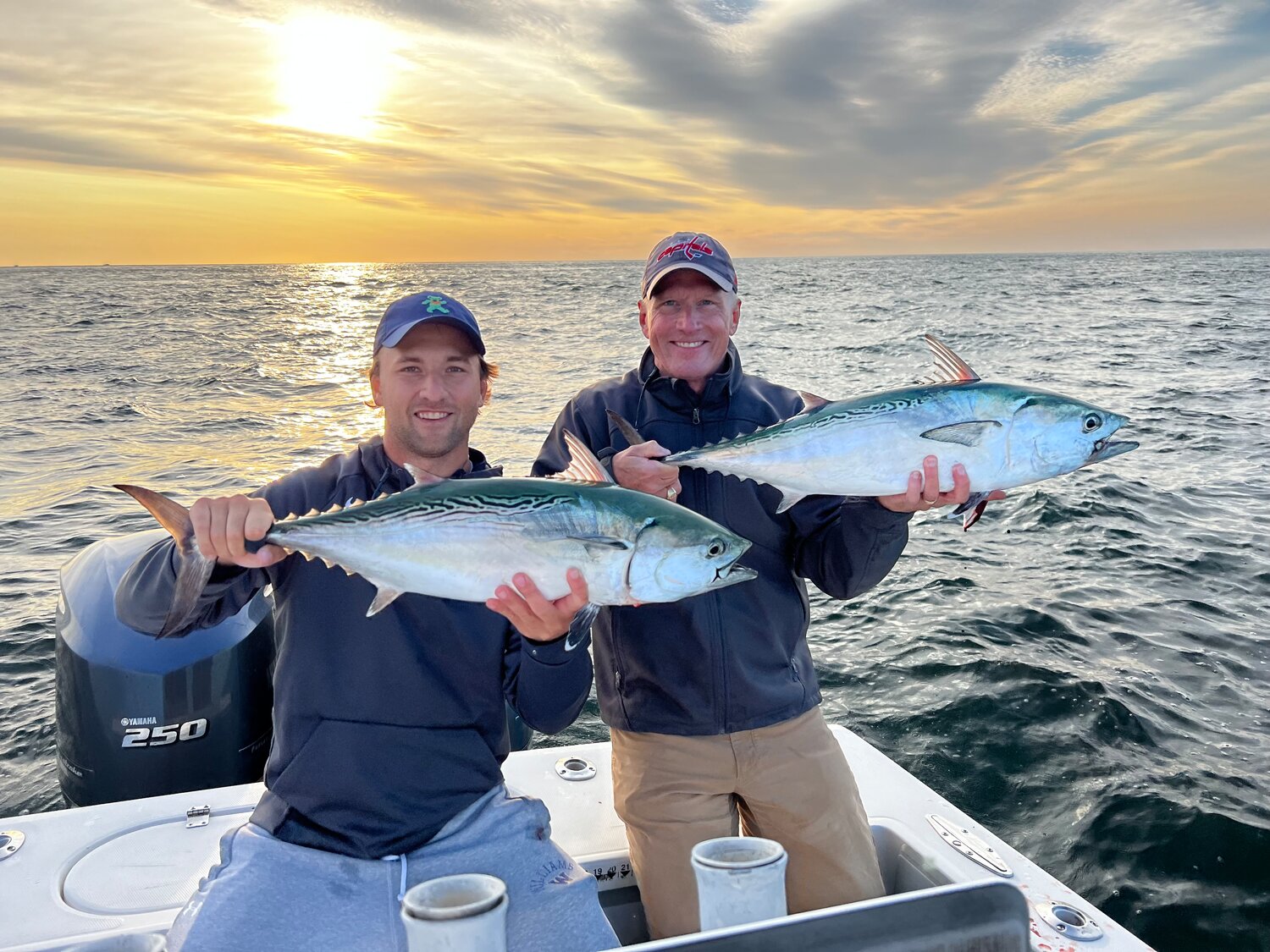 Julian and Chris Detmer with a pair of false albacore they caught.