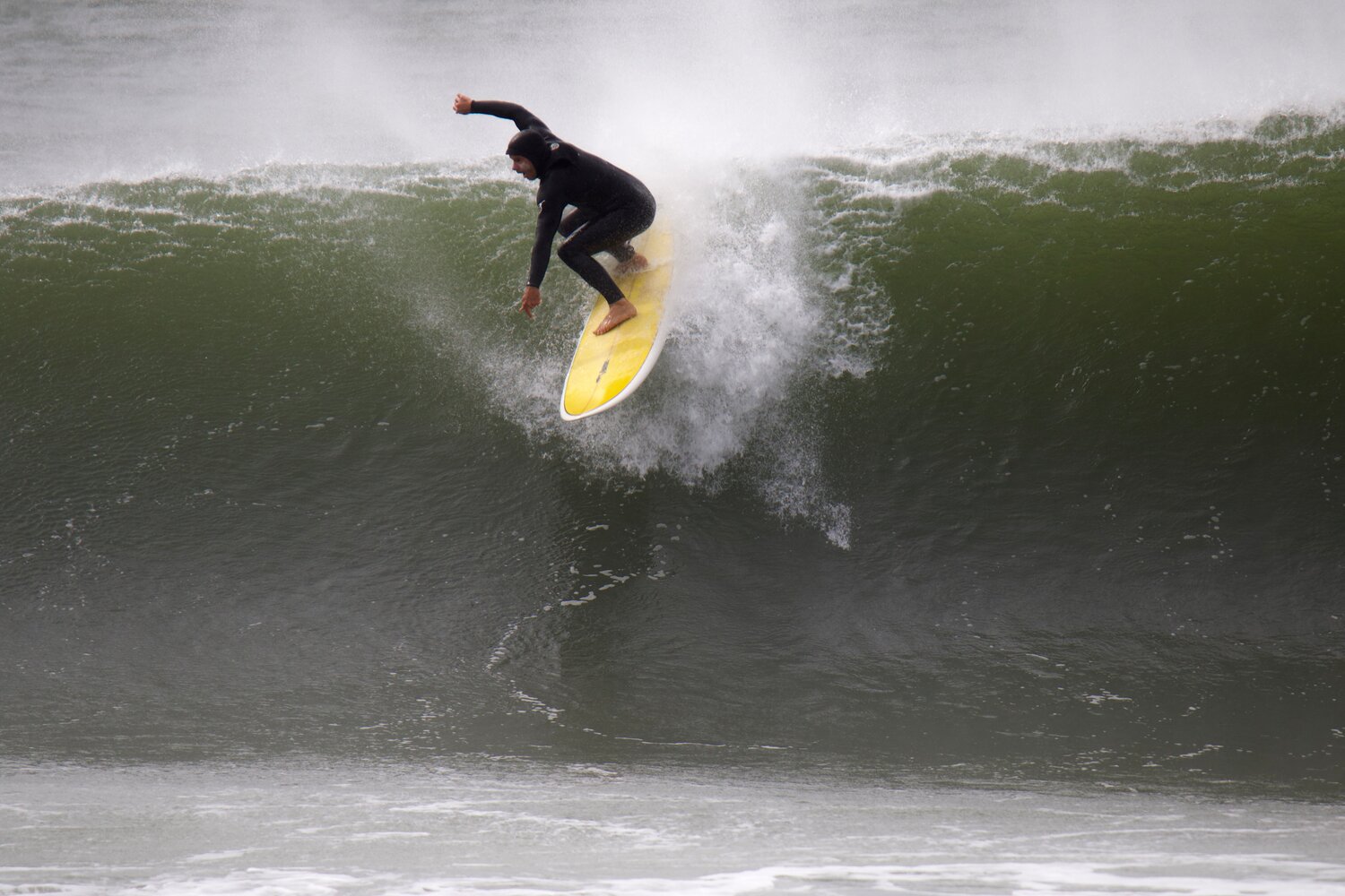 A surfer catches a wave in Maddequecham Friday.