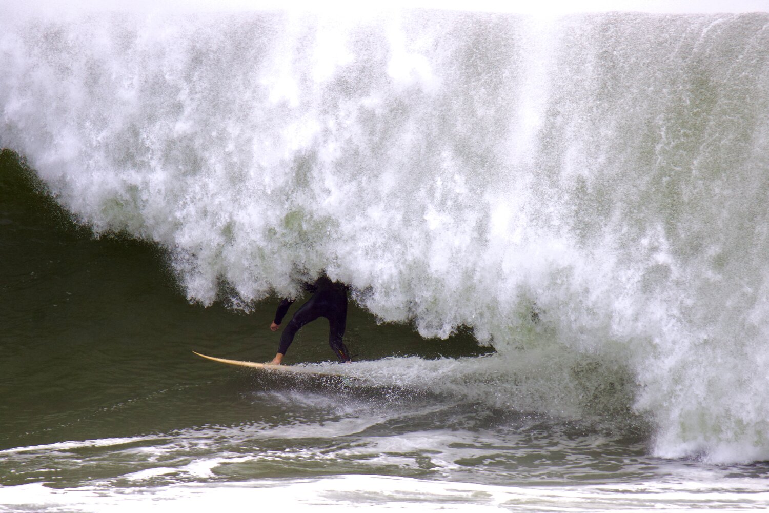 Several surfers took advantage of high surf from Hurricane Lee on Friday at Maddequecham Beach.
