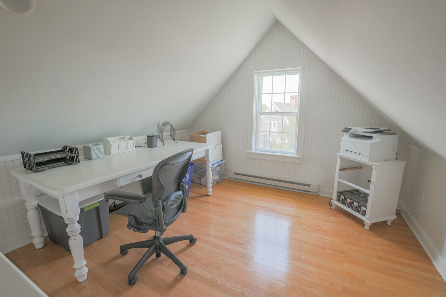 The third floor of the home has an office space, above, and guest bedroom.