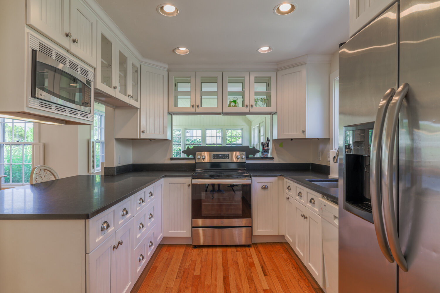 The modern kitchen has stainless-steel appliances by GE, black granite countertops and plenty of cabinets for storage.