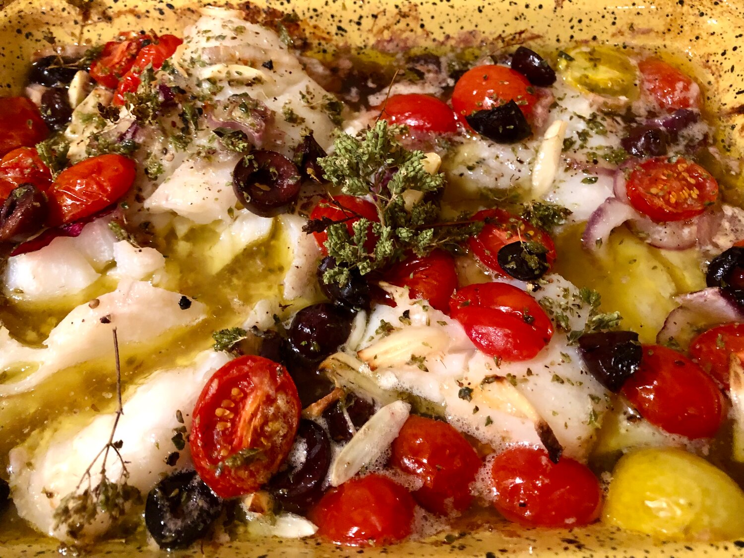 Mediterranean Baked Cod is a quick, colorful and delicious weeknight preparation enhanced by onions, olives, garlic and tomatoes.